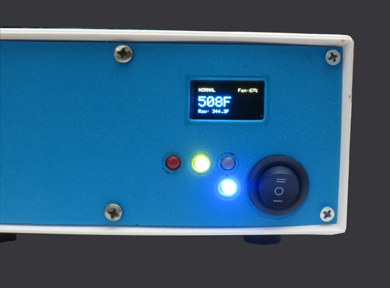 stoveLogic front panel close-up: OLED reading 508°F in NORMAL at 67% fan, red green and blue LEDs, power rocker